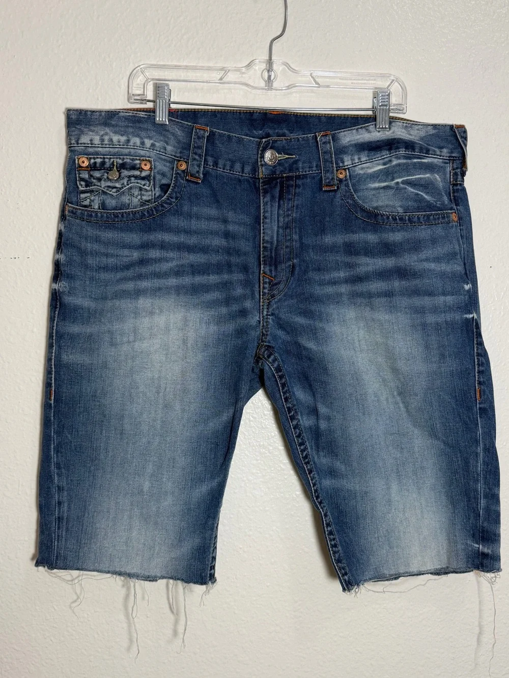 True Religion contrast denim shorts, distressed blue wash and raw, frayed hem 38